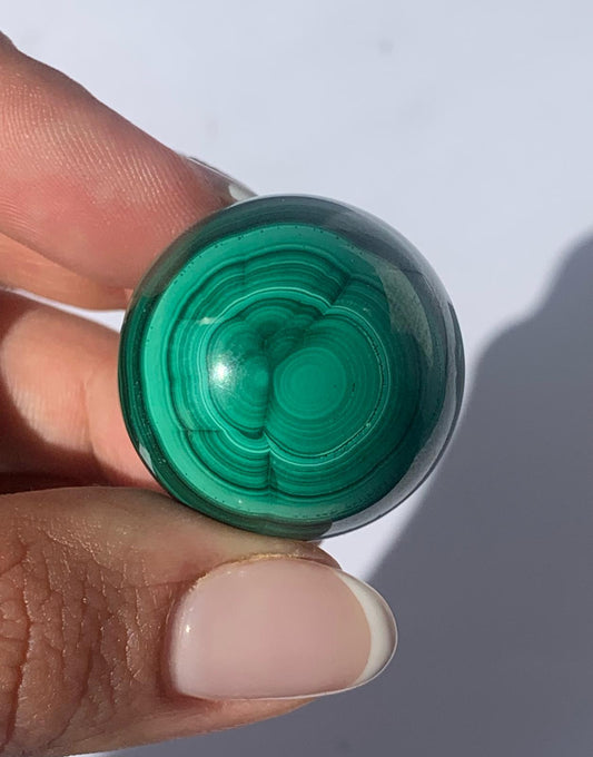 Sfera in malachite / Protezione e trasformazione